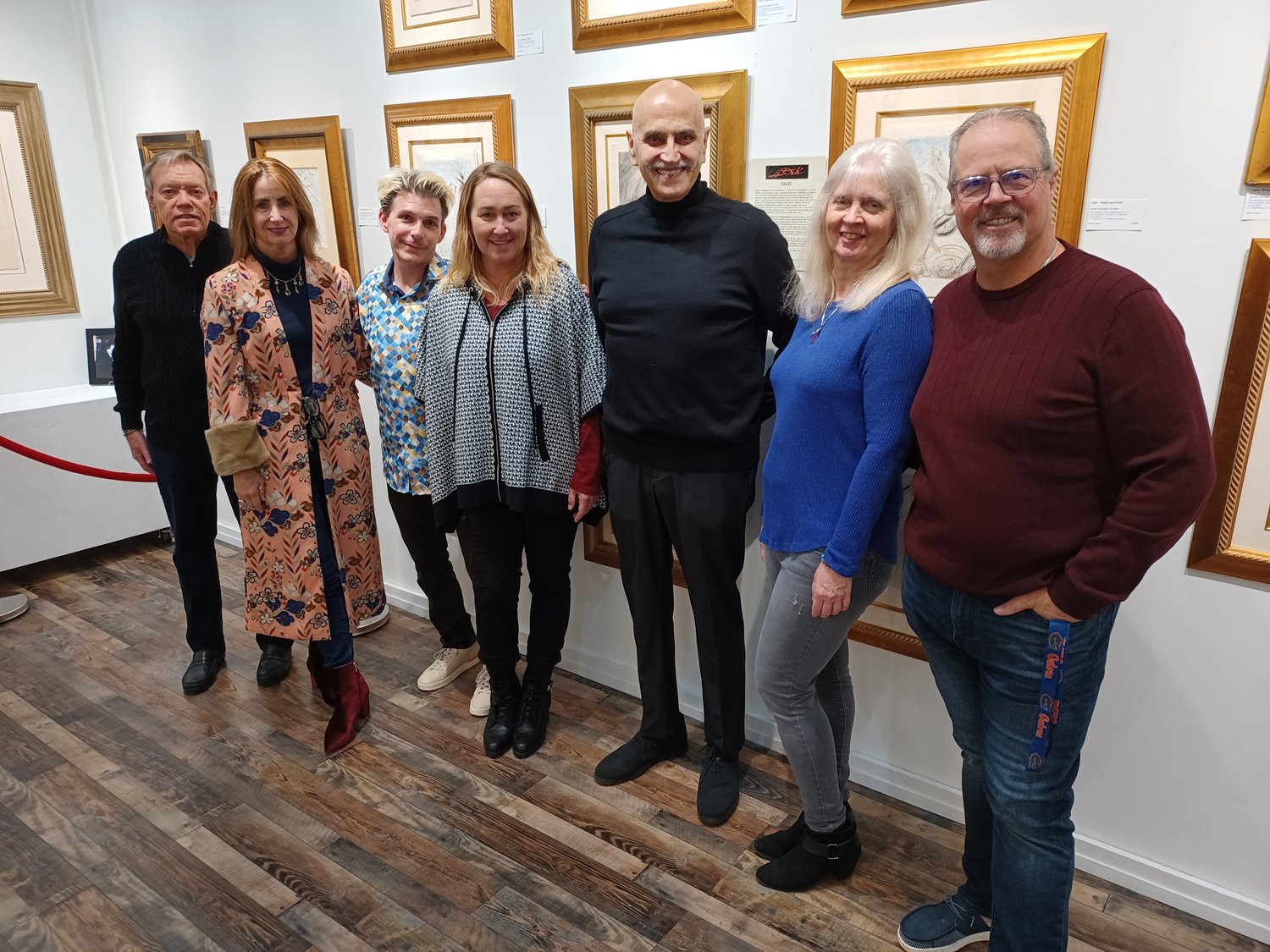 Gathered at Gallery 725 during the opening reception of “Dali: The Argillet Collection” on Jan. 28 are, from left, Mike Turnage, Cynthia Turnage, Matt Winghart, Shayna Winghart, Nim Vaswani, Marci Connelly and Chris Connelly.